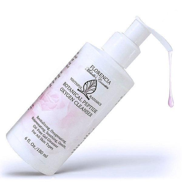 A bottle of Botanical Peptide Oxygen Revitalizing Cleanser tipped at a 45 degree angle with cleanser coming from the top.