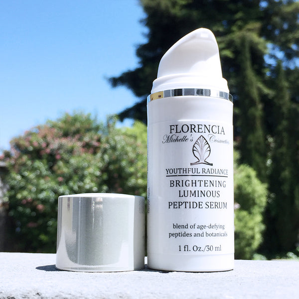 A bottle of Brightening Luminous Peptide Serum - Youthful Radiance.