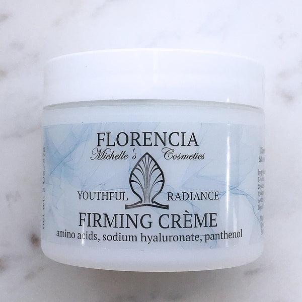 A container of Firming Cream.