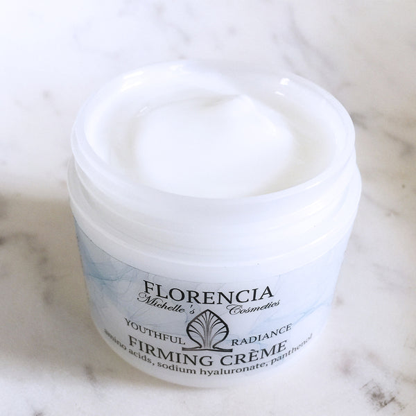 An open container of Firming Cream.