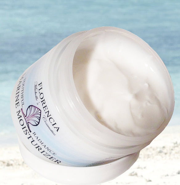 An open jar of Marine Moisturizer Youthful Radiance tilted at a 45 degree angle.
